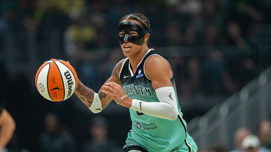 Sep 5, 2025; Seattle, Washington, USA;  New York Liberty guard Natasha Cloud (9) dribbles the ball against the Seattle Storm at Climate Pledge Arena. Mandatory Credit: Stephen Brashear-Imagn Images