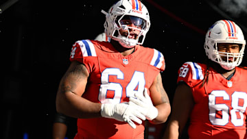 Dec 1, 2024; Foxborough, Massachusetts, USA; New England Patriots guard Layden Robinson (64) walks out of the player's tunnel before a game against the Indianapolis Colts at Gillette Stadium. Mandatory Credit: Eric Canha-Imagn Images