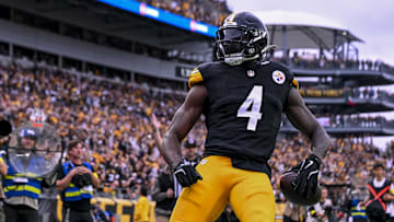 Oct 12, 2025; Pittsburgh, Pennsylvania, USA; Pittsburgh Steelers wide receiver DK Metcalf (4) makes a catch for a touchdown during the fourth quarter at Acrisure Stadium. 
