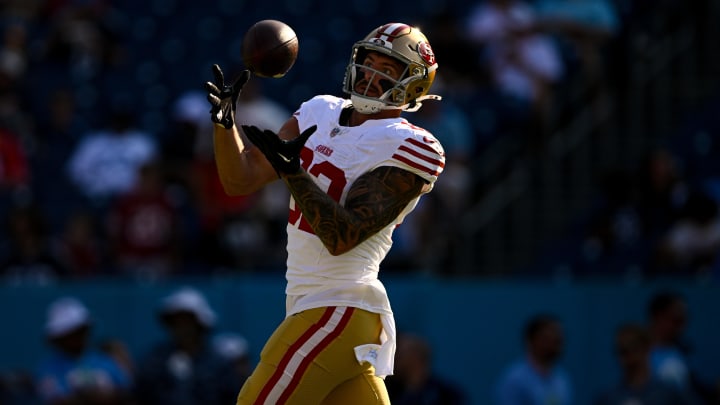 Aug 10, 2024; Nashville, Tennessee, USA;  San Francisco 49ers tight end Eric Saubert (82) makes a catch against the Tennessee Titans during pregame warmups at Nissan Stadium. Mandatory Credit: Steve Roberts-USA TODAY Sports