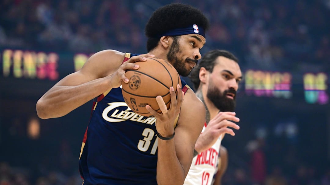 Nov 19, 2025; Cleveland, Ohio, USA; Cleveland Cavaliers center Jarrett Allen (31) rebounds against Houston Rockets center Steven Adams (12) during the first half at Rocket Arena. Mandatory Credit: David Dermer-Imagn Images