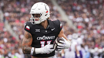 Sep 13, 2025; Cincinnati, Ohio, USA;  Cincinnati Bearcats tight end Joe Royer (11) catches a pass for a touchdown against the Northwestern State Demons in the first half at Nippert Stadium. Mandatory Credit: Aaron Doster-Imagn Images