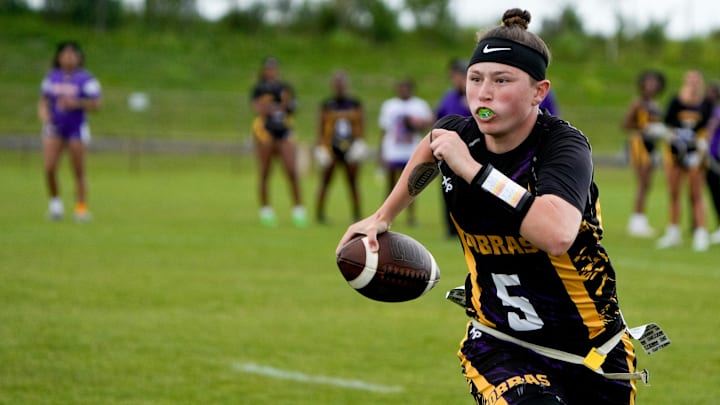 Fort Pierce Central’s Adrienne Rivera (5) runs the ball against Centennial during a girls flag football game, Tuesday, March 4, 2025, at Fort Pierce Central High School.