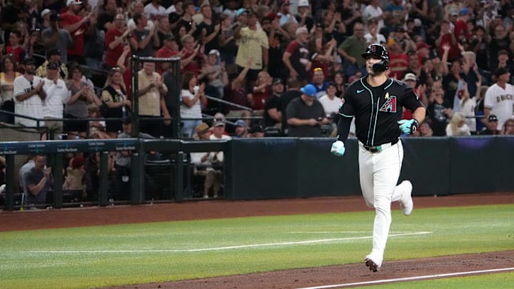 Sep 1, 2024; Phoenix, Arizona, USA; Arizona Diamondbacks outfielder Randal Grichuk (15) runs the bases after hitting a three run home run against the Los Angeles Dodgers during the second inning at Chase Field. Mandatory Credit: Joe Camporeale-Imagn Images