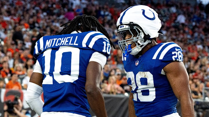 Indianapolis Colts running back Jonathan Taylor (28) and Indianapolis Colts wide receiver Adonai Mitchell (10) celebrate after scoring a touchdown in the first quarter between the Cincinnati Bengals and the Indianapolis Colts at Paycor Stadium in Cincinnati on Thursday, Aug. 22, 2024.