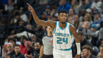 Nov 4, 2024; Minneapolis, Minnesota, USA; Charlotte Hornets forward Brandon Miller (24) points to a teammate after making a three-point shot against the Minnesota Timberwolves in the first half at Target Center. Mandatory Credit: Jesse Johnson-Imagn Images