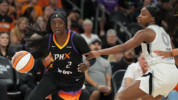 A photo of Kahleah Copper driving with the bal