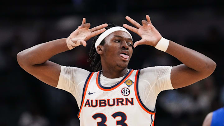 Auburn Tigers forward Sebastian Williams-Adams (33) celebrates a three-point basket Sunday, April 5, 2026, during the NIT men's basketball championship game at Gainbridge Fieldhouse in Indianapolis.