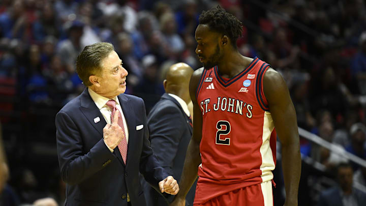 Mar 22, 2026; San Diego, CA, USA; St. John's basketball head coach Rick Pitino talks with forward Sadiku Ibine Ayo (2) in the first half against the Kansas Jayhawks during a second round game of the men's 2026 NCAA Tournament at Viejas Arena.