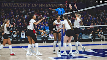 Nebraska volleyball players celebrate a point at Washington.