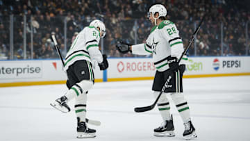 Nov 20, 2025; Vancouver, British Columbia, CAN; Dallas Stars forward Jason Robertson (21) and defenseman Alexander Petrovic (28) celebrate Robertson’s goal against the Vancouver Canucks in the first period at Rogers Arena. Mandatory Credit: Bob Frid-Imagn Images