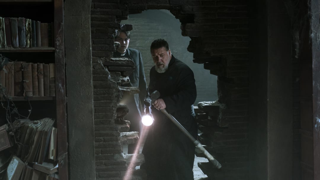 Father Esquibel (Daniel Zovatto) and Father Gabriele Amorth (Russell Crowe) in Screen Gems’ THE POPE’S EXORCIST.