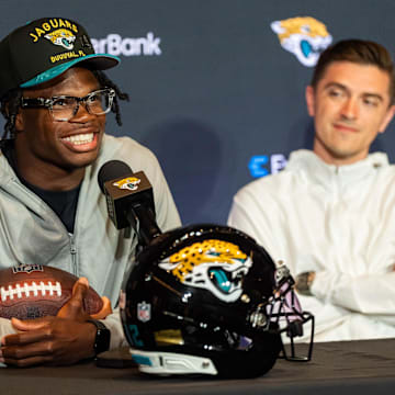 The Jacksonville Jaguars’ first-round pick, Colorado Buffaloes wide receiver and defensive back Travis Hunter, left, answers questions as General Manager James Gladstone, right, sits next to him during a press conference Friday, March 25, 2025 at Miller Electric Center in Jacksonville, Fla. [Doug Engle/Florida Times-Union]