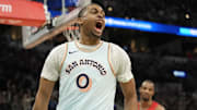 Apr 13, 2025; San Antonio, Texas, USA; San Antonio Spurs forward Keldon Johnson (0) reacts after scoring during the second half against the Toronto Raptors at Frost Bank Center.