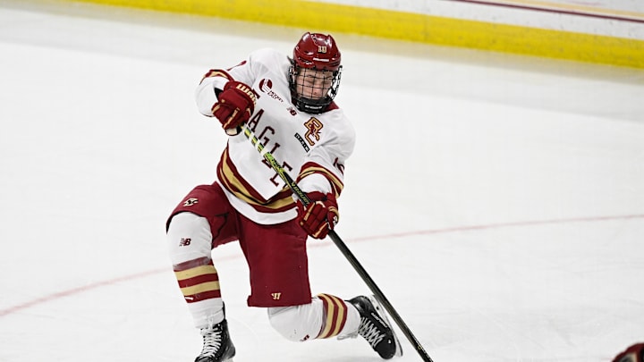 Feb 28, 2025; Chestnut Hill, MA, USA; Boston College forward James Hagens (10) shoots the puck against the University of New Hampshire Wildcats during the third period at Conte Forum. Mandatory Credit: Eric Canha-Imagn Images