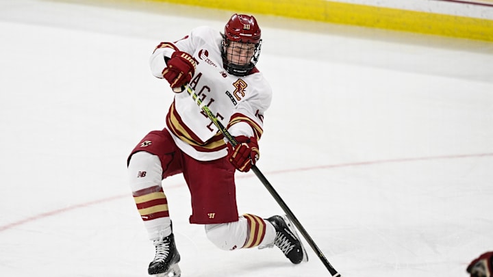 Feb 28, 2025; Chestnut Hill, MA, USA; Boston College forward James Hagens (10) shoots the puck against the University of New Hampshire Wildcats during the third period at Conte Forum. Mandatory Credit: Eric Canha-Imagn Images