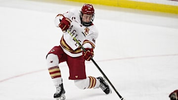 Feb 28, 2025; Chestnut Hill, MA, USA; Boston College forward James Hagens (10) shoots the puck against the University of New Hampshire Wildcats during the third period at Conte Forum. Mandatory Credit: Eric Canha-Imagn Images