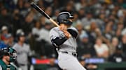 May 13, 2025; Seattle, Washington, USA; New York Yankees center fielder Trent Grisham (12) hits a single against the Seattle Mariners during the eighth inning at T-Mobile Park.
