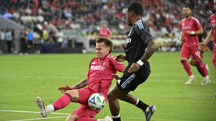 Jul 30, 2025; St. Louis, Missouri, USA; St. Louis City midfielder Conrad Wallem (6) blocks a pass from Aston Villa defender Ian Maatsen (22) in the first half at Energizer Park. Mandatory Credit: Joe Puetz-Imagn Images
