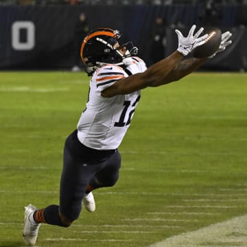 Velus Jones Jr. tries to haul in a pass and get his feet in along the sidelines against Arizona last season.