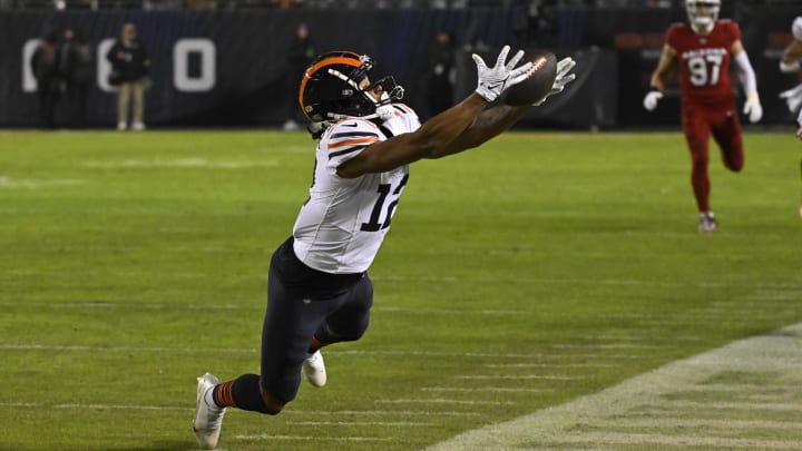 Velus Jones Jr. tries to haul in a pass and get his feet in along the sidelines against Arizona last season.