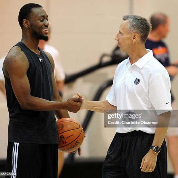 Kemba Walker and Mike Dunlap