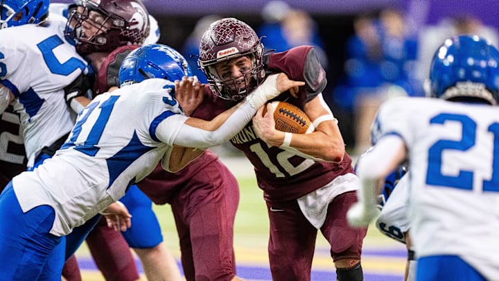 Grundy Center's Judd Jirovsky (12) runs the ball up the middle on Thursday, Nov. 21, 2024, at the UNI-Dome in Cedar Falls, IA. Grundy Center's Judd Jirovsky (12) runs the ball up the middle on Thursday, Nov. 21, 2024, at the UNI-Dome in Cedar Falls, IA.