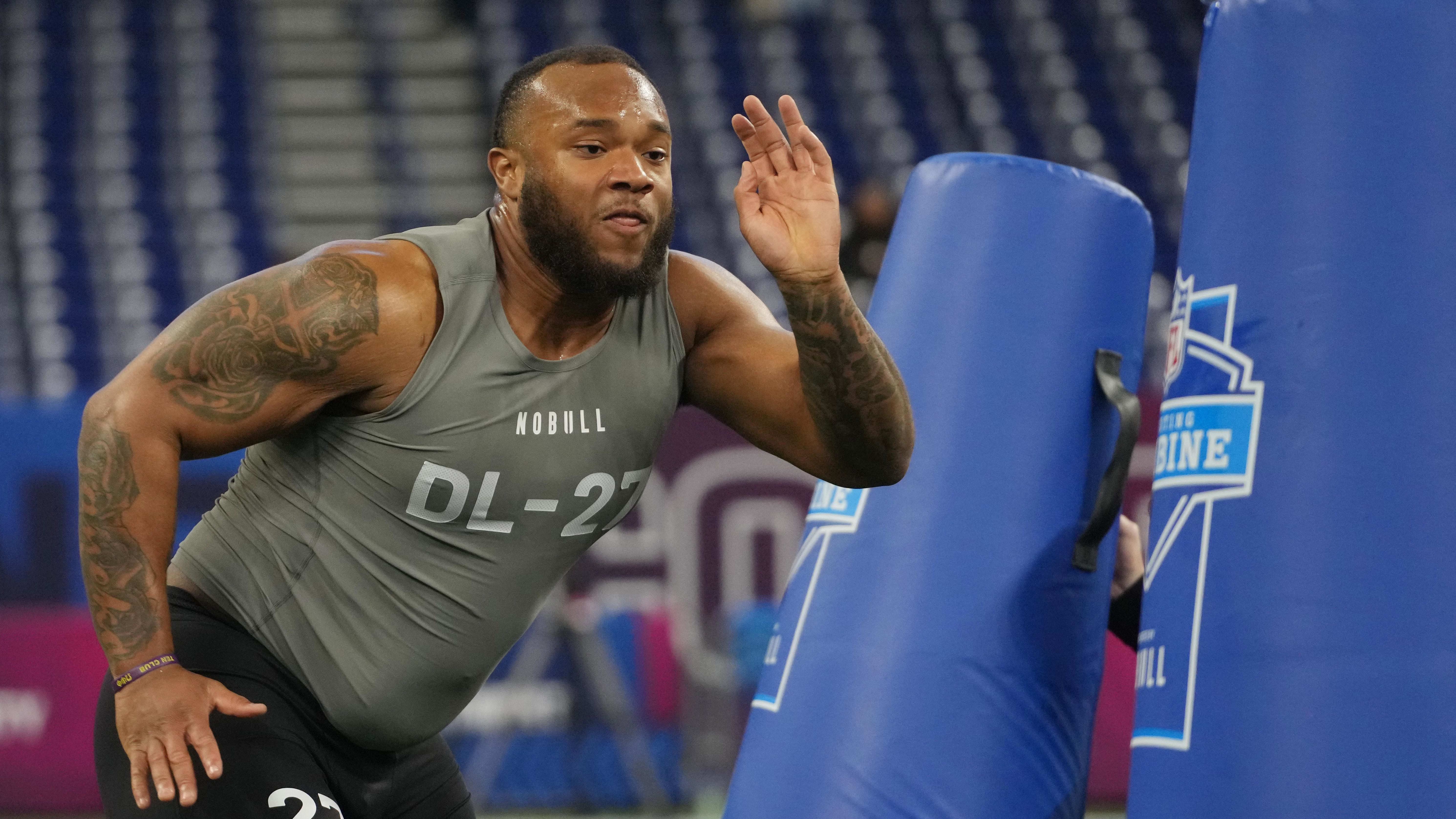 Louisiana State defensive lineman Mekhi Wingo (DL27) works out at the NFL Scouting Combine.