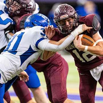 Grundy Center's Judd Jirovsky (12) runs the ball up the middle on Thursday, Nov. 21, 2024, at the UNI-Dome in Cedar Falls, IA.