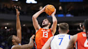 Mar 23, 2025; Milwaukee, WI, USA;  Illinois Fighting Illini center Tomislav Ivisic (13) shoots against Kentucky Wildcats forward Brandon Garrison (10) during the second half in the second round of the NCAA Tournament at Fiserv Forum. Mandatory Credit: Jeff Hanisch-Imagn Images