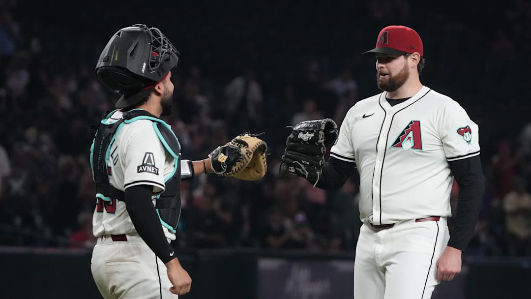 Sep 11, 2024; Phoenix, Arizona, USA; Arizona Diamondbacks catcher Adrian Del Castillo (25) and pitcher Jordan Montgomery (52) celebrate after defeating the Texas Rangers at Chase Field. Mandatory Credit: Rick Scuteri-Imagn Images