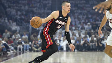 Apr 23, 2025; Cleveland, Ohio, USA; Miami Heat guard Tyler Herro (14) dribbles against the Cleveland Cavaliers in the first quarter of game two of the first round of the 2025 NBA Playoffs at Rocket Arena. Mandatory Credit: David Richard-Imagn Images