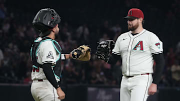 Sep 11, 2024; Phoenix, Arizona, USA; Arizona Diamondbacks catcher Adrian Del Castillo (25) and pitcher Jordan Montgomery (52) celebrate after defeating the Texas Rangers at Chase Field. Mandatory Credit: Rick Scuteri-Imagn Images