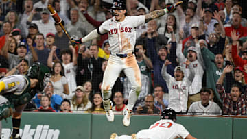 Sep 17, 2025; Boston, Massachusetts, USA; Boston Red Sox left fielder Jarren Duran (16) reacts as third baseman Nate Eaton (40) slides home to score the winning run against Athletics catcher Shea Langeliers (23) during the tenth inning at Fenway Park. Mandatory Credit: Eric Canha-Imagn Images