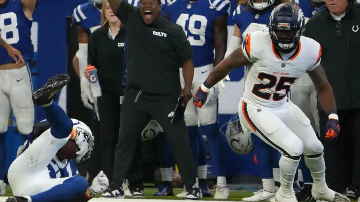 Indianapolis Colts cornerback Kenny Moore II (23) intercepts a ball meant for Denver Broncos running back Samaje Perine (25) during a preseason game Sunday, Aug. 11, 2024, at Lucas Oil Stadium in Indianapolis.