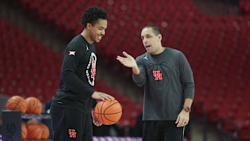 Houston Cougars guard Ramon Walker Jr. (3) talks with assistant coach Kellen Sampson before the game against the TCU Horned Frogs at Fertitta Center.