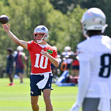 Jul 23, 2025; Foxborough, MA, USA; New England Patriots quarterback Drake Maye (10) throws a pass to wide receiver Stefon Diggs (8) during training camp at Gillette Stadium. Mandatory Credit: Eric Canha-Imagn Images