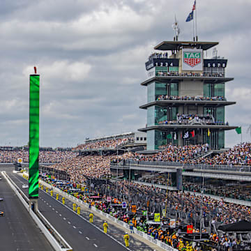May 26, 2024; Indianapolis, Indiana, USA; Indycar Series driver Scott McLaughlin leads the field to the green flag to start the 108th running of the Indianapolis 500 at Indianapolis Motor Speedway. 
