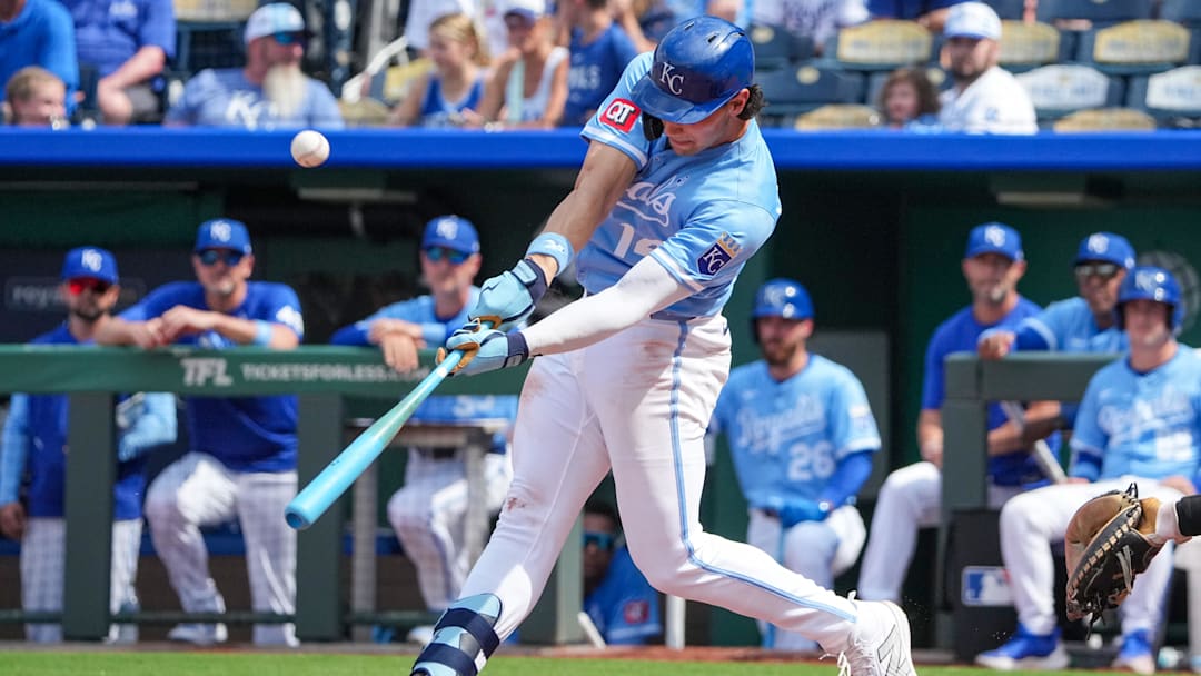 Jun 15, 2025; Kansas City, Missouri, USA; Kansas City Royals right fielder Jac Caglianone (14) hits a pop up against the Athletics during the ninth inning of the game at Kauffman Stadium. Mandatory Credit: Denny Medley-Imagn Images