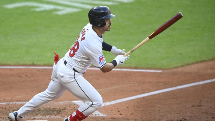 Cleveland Guardians left fielder Steven Kwan (38) singles in the fifth inning against the Chicago Cubs at Progressive Field.