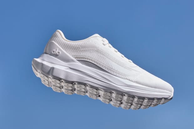 White Alo Yoga running shoes.