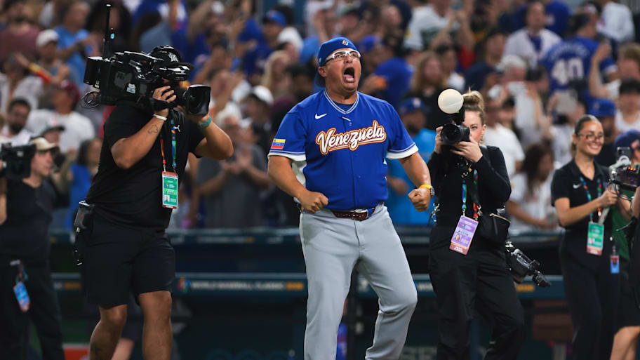 Venezuela manager Omar Lopez celebrates after winning