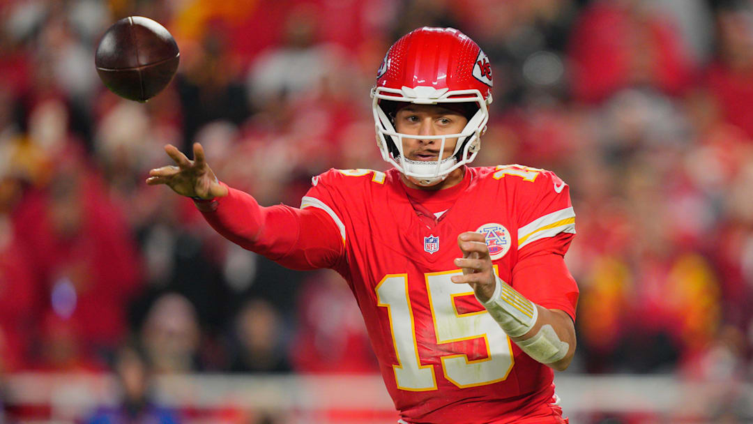 Oct 27, 2025; Kansas City, Missouri, USA; Kansas City Chiefs quarterback Patrick Mahomes (15) passes the ball against the Washington Commanders during the third quarter of the game at GEHA Field at Arrowhead Stadium. Mandatory Credit: Jay Biggerstaff-Imagn Images
