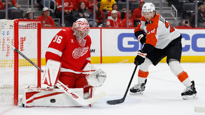 Mar 28, 2026; Detroit, Michigan, USA;  Detroit Red Wings goaltender John Gibson (36) makes a save on Philadelphia Flyers center Christian Dvorak (22) in the first period at Little Caesars Arena.