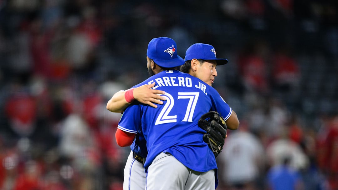 Apr 20, 2026; Anaheim, California, USA; Toronto Blue Jays third baseman Kazuma Okamoto (7) and first baseman Vladimir Guerrero Jr. (27) hug after defeating the Los Angeles Angels at Angel Stadium. Mandatory Credit: William Liang-Imagn Images