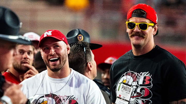 Sep 7, 2024; Lincoln, Nebraska, USA; Bussin’ With The Boys’ Will Compton and Taylor Lewan stand on the sideline during the third quarter between the Nebraska Cornhuskers and the Colorado Buffaloes at Memorial Stadium. Mandatory Credit: Dylan Widger-Imagn Images Sep 7, 2024; Lincoln, Nebraska, USA; Bussin’ With The Boys’ Will Compton and Taylor Lewan stand on the sideline during the third quarter between the Nebraska Cornhuskers and the Colorado Buffaloes at Memorial Stadium. Mandatory Credit: Dylan Widger-Imagn Images