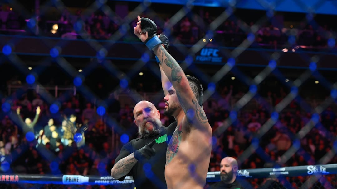 Feb 22, 2025; Seattle, Washington, USA; Anthony Hernandez (blue gloves)  celebrates defeating Brendan Allen (red gloves) in the middleweight bout during UFC Fight Night at Climate Pledge Arena. Mandatory Credit: Steven Bisig-Imagn Images