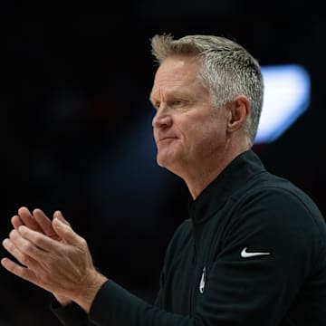 Golden State Warriors head coach Steve Kerr claps during the first half against the Portland Trailblazers at Moda Center. 