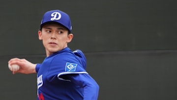 Feb 12, 2025; Glendale, AZ, USA; Los Angeles Dodgers pitcher Roki Sasaki (11) throws during a Spring Training workout at Camelback Ranch.