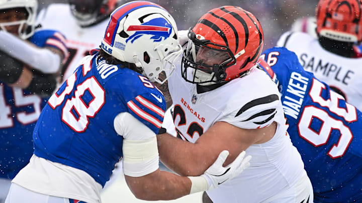 Dec 7, 2025; Orchard Park, New York, USA; Cincinnati Bengals guard Dylan Fairchild (63) blocks Buffalo Bills linebacker Matt Milano (58) in the first quarter at Highmark Stadium. Mandatory Credit: Mark Konezny-Imagn Images